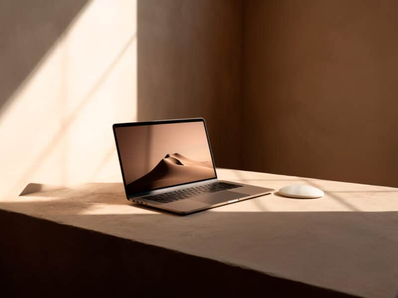 macbook with website in a minimal background